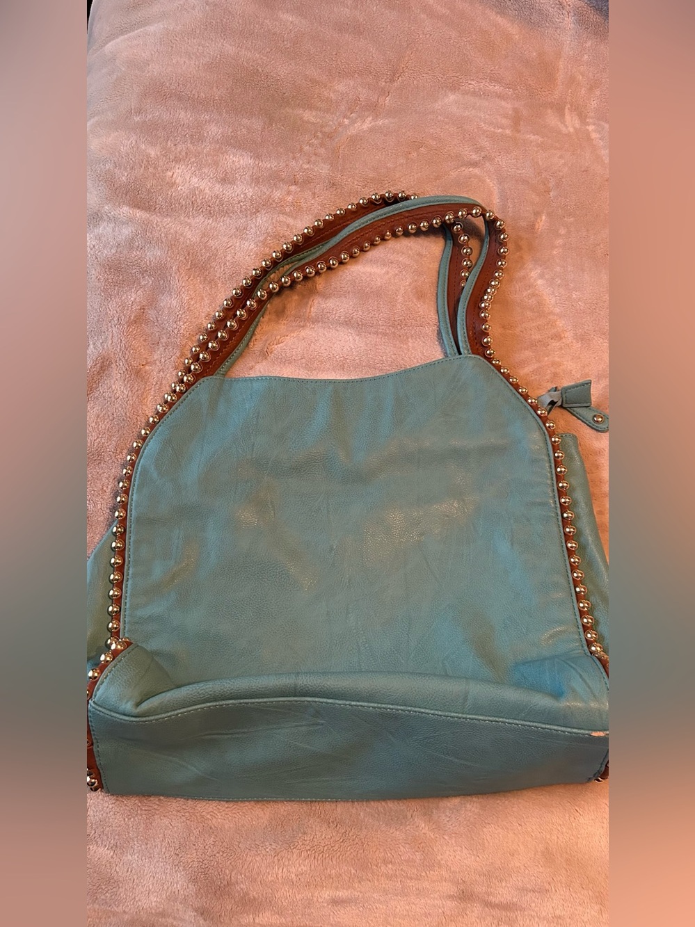 Big Buddha Grayson hobo bag features teal faux leather highlighted by polished